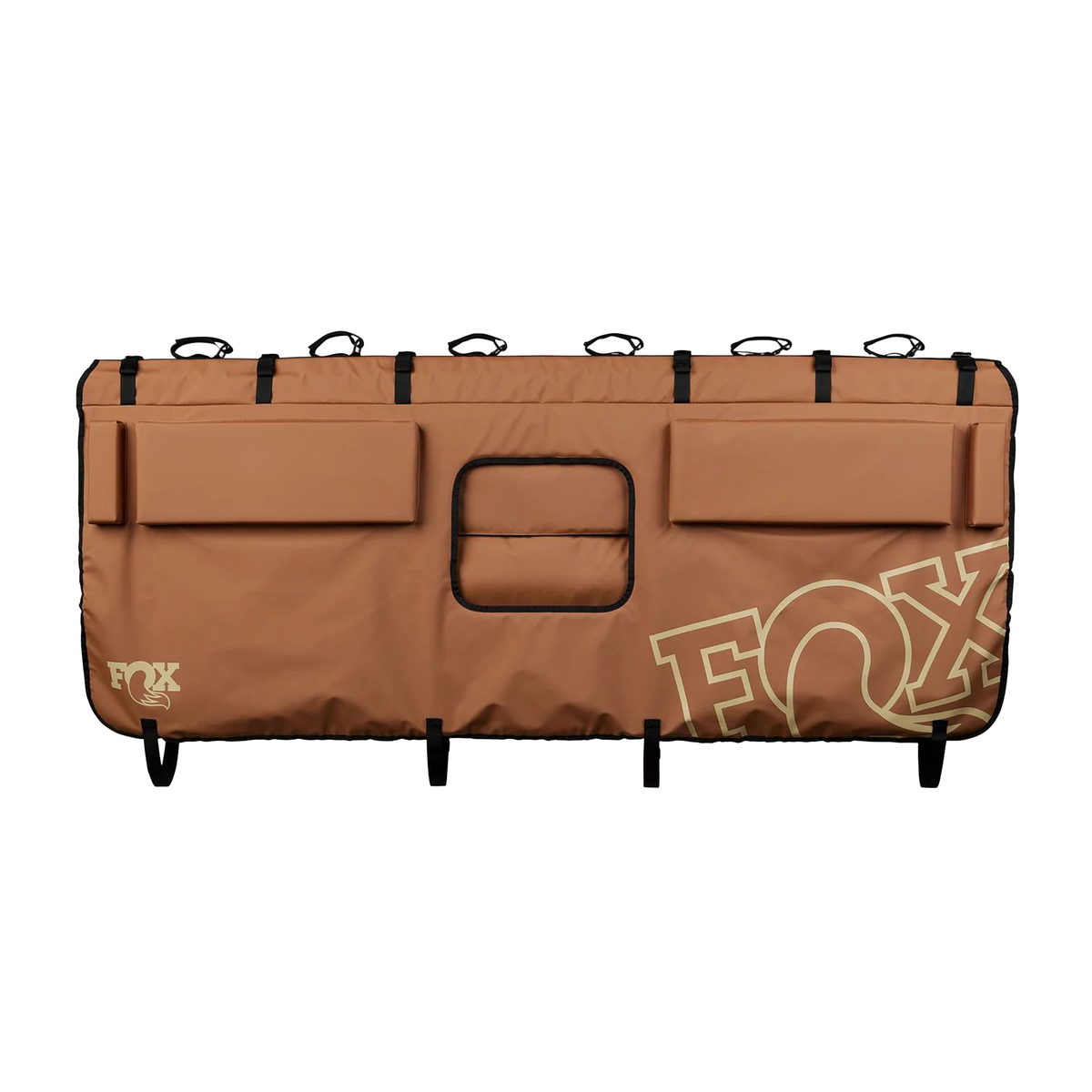 Brown overland tailgate pad with storage pockets, center window, and FOX logo