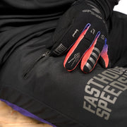Black knee panel on riding pants with Speedshop logo and purple accent stitch