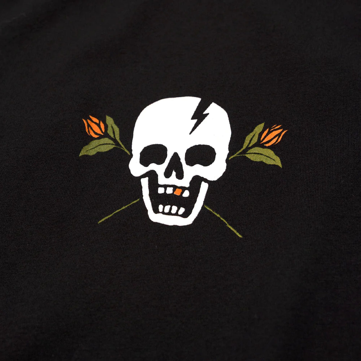 Black T-shirt close-up of white skull lightning graphic with orange and green leaves