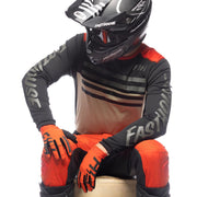 Long-sleeve cycling jersey, black with cream chest stripes and orange accent trim