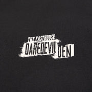 Black T-shirt close-up of distressed "Daredevil" logo print