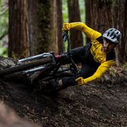 Alloy block jersey with yellow long sleeves and black body on a cyclist
