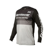 Youth long-sleeve riding jersey in black, gray, and white with checkered logo