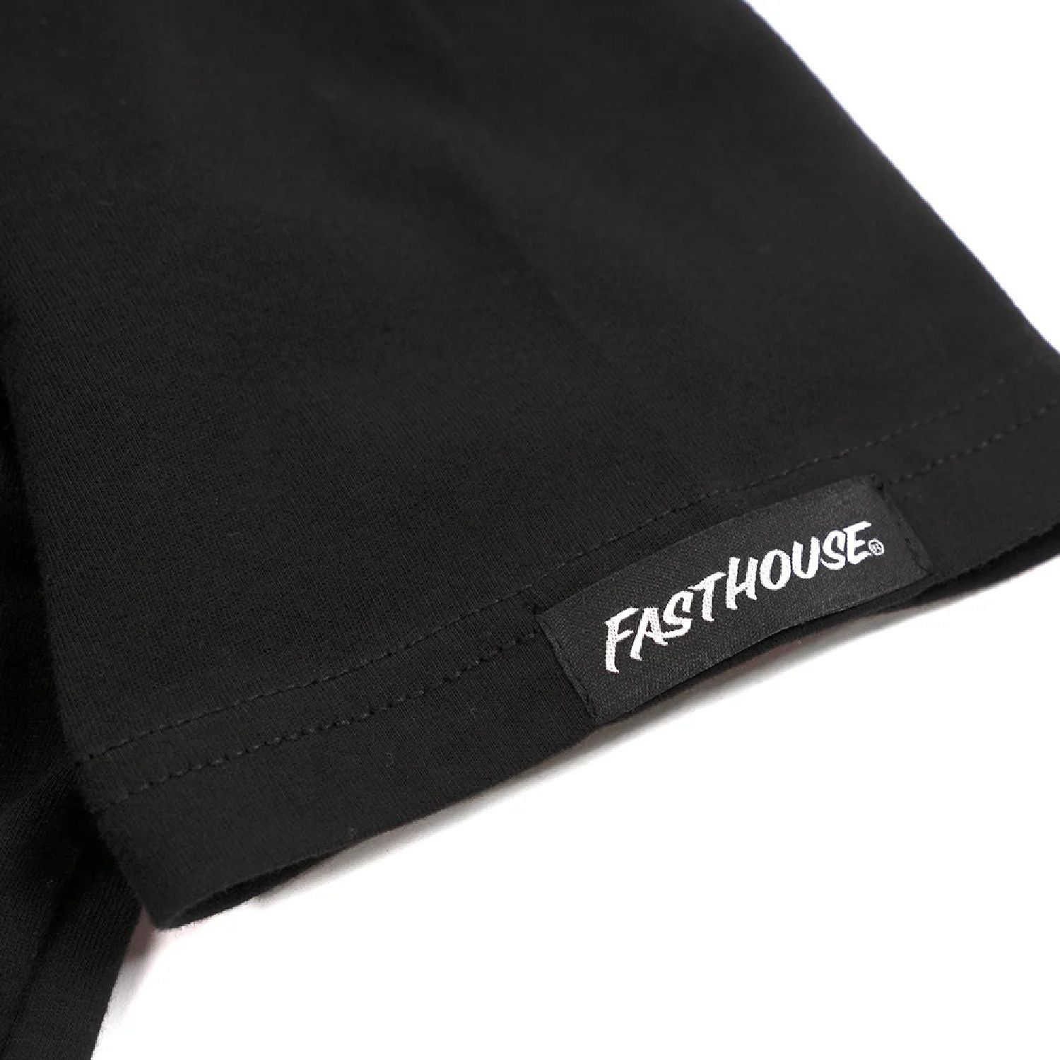 Black T-shirt sleeve hem with Fastthouse logo patch
