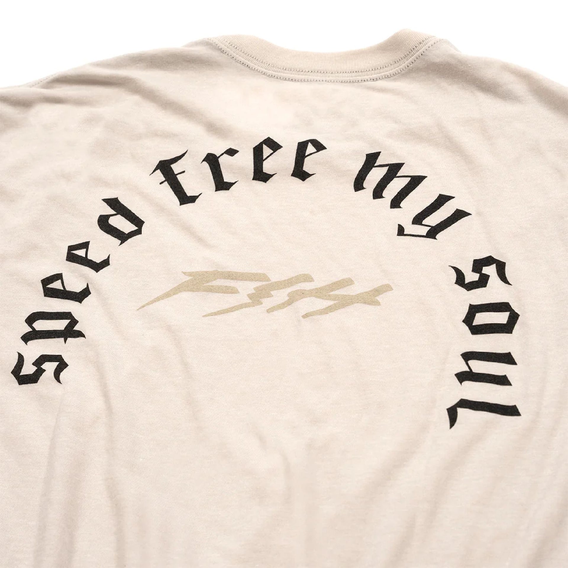 Cream T-shirt back graphic with large 'free my soul' arch and central logo.