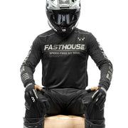Black off-road long-sleeve jersey with “SPEED FREE MY SOUL” text, worn while seated