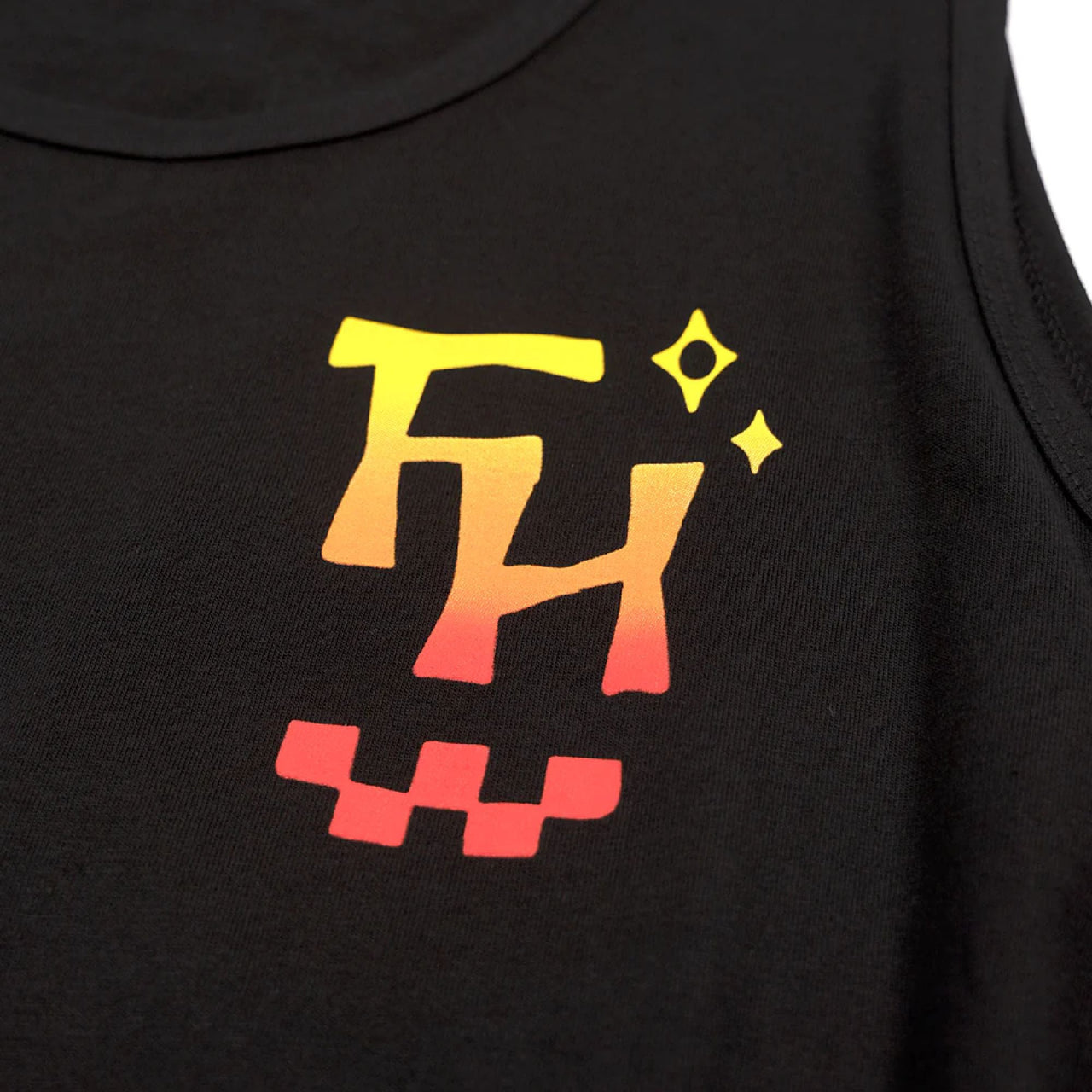 Fasthouse Palm tank top close-up with colorful graphic print on dark fabric