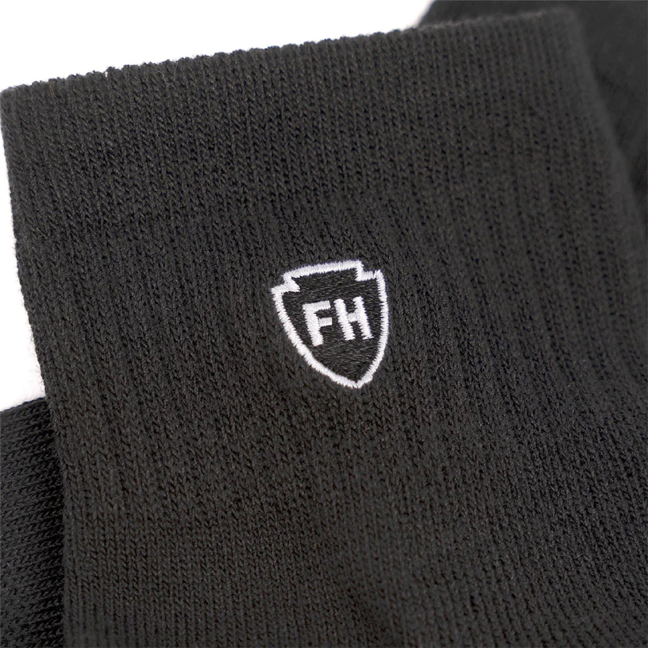 Black ankle performance sock cuff with white FH crest