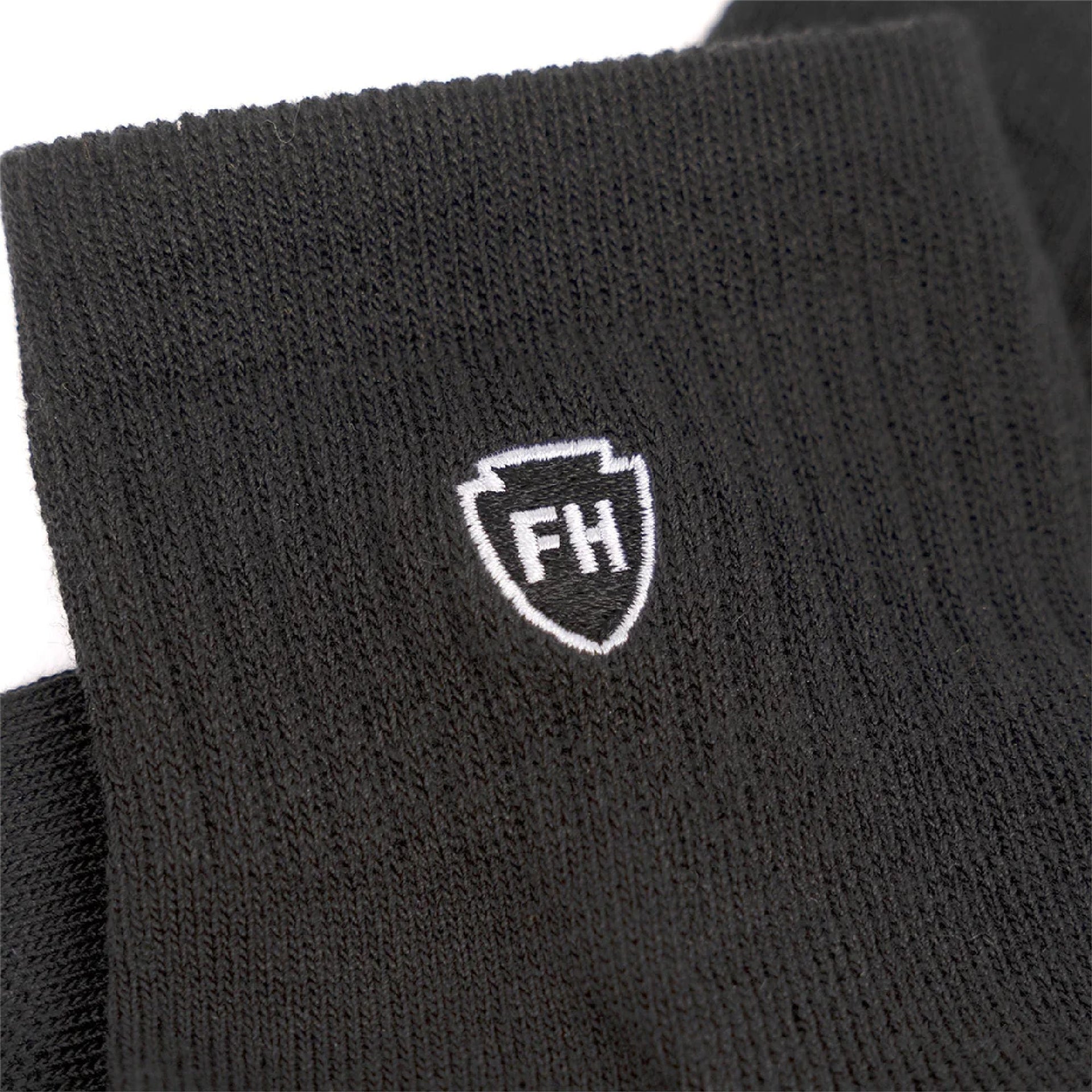 Black ankle performance sock cuff with white FH crest