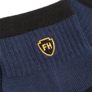 Midnight navy ankle performance sock cuff with yellow FH crest
