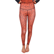 Burnt orange line-art face print base layer leggings with slim ankle-length fit