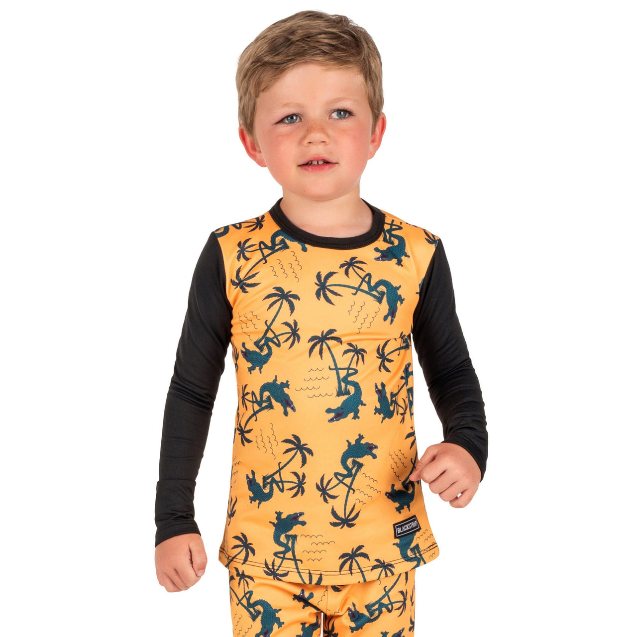Youth therma baselayer top, orange dinosaur print with black long sleeves