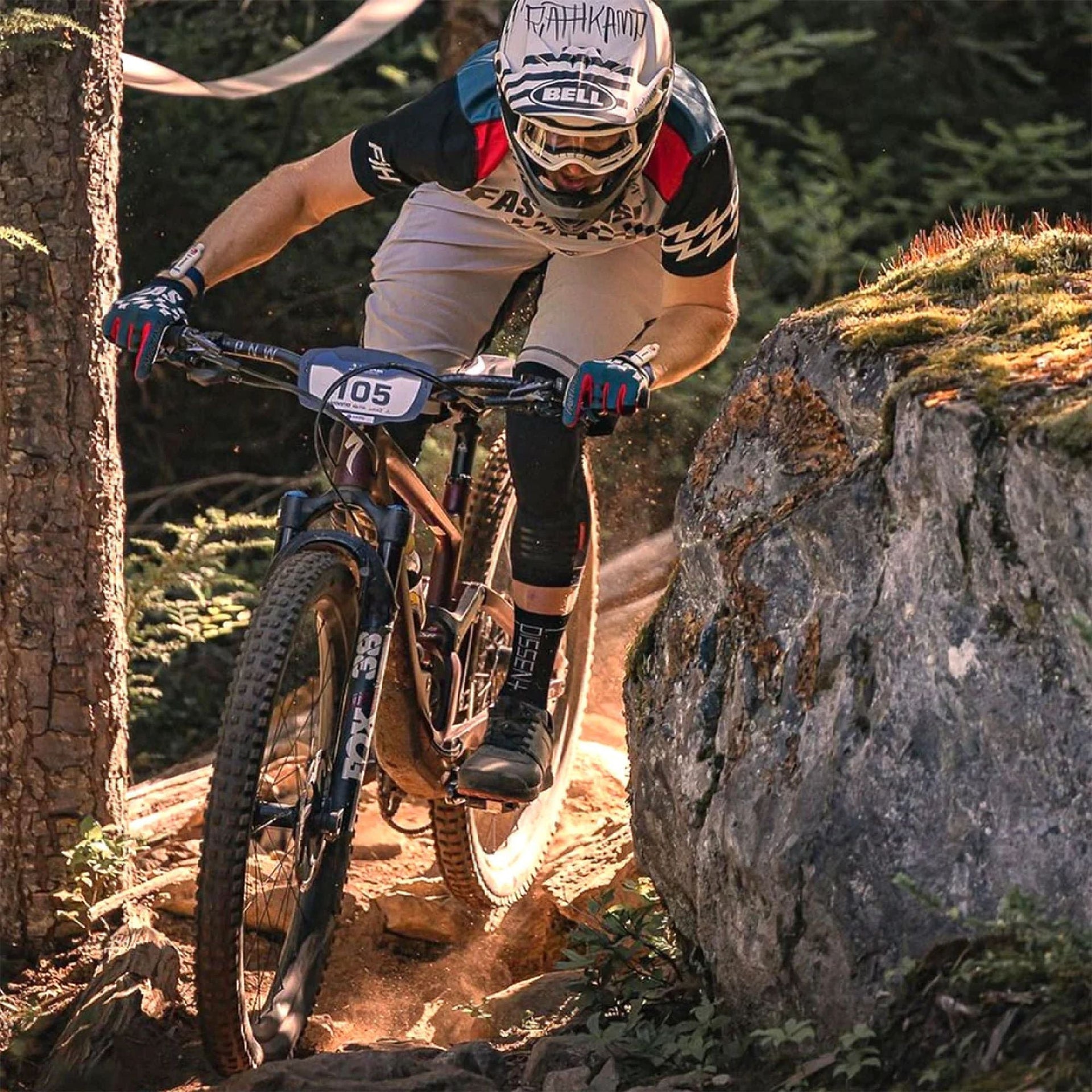 Short-sleeve motocross jersey on rider, light gray body with black sleeves and red collar