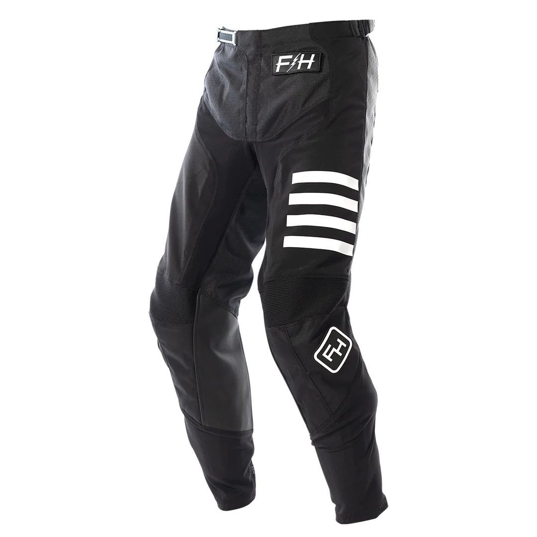 Black motocross pants with white stripe graphics and F4H logo patch