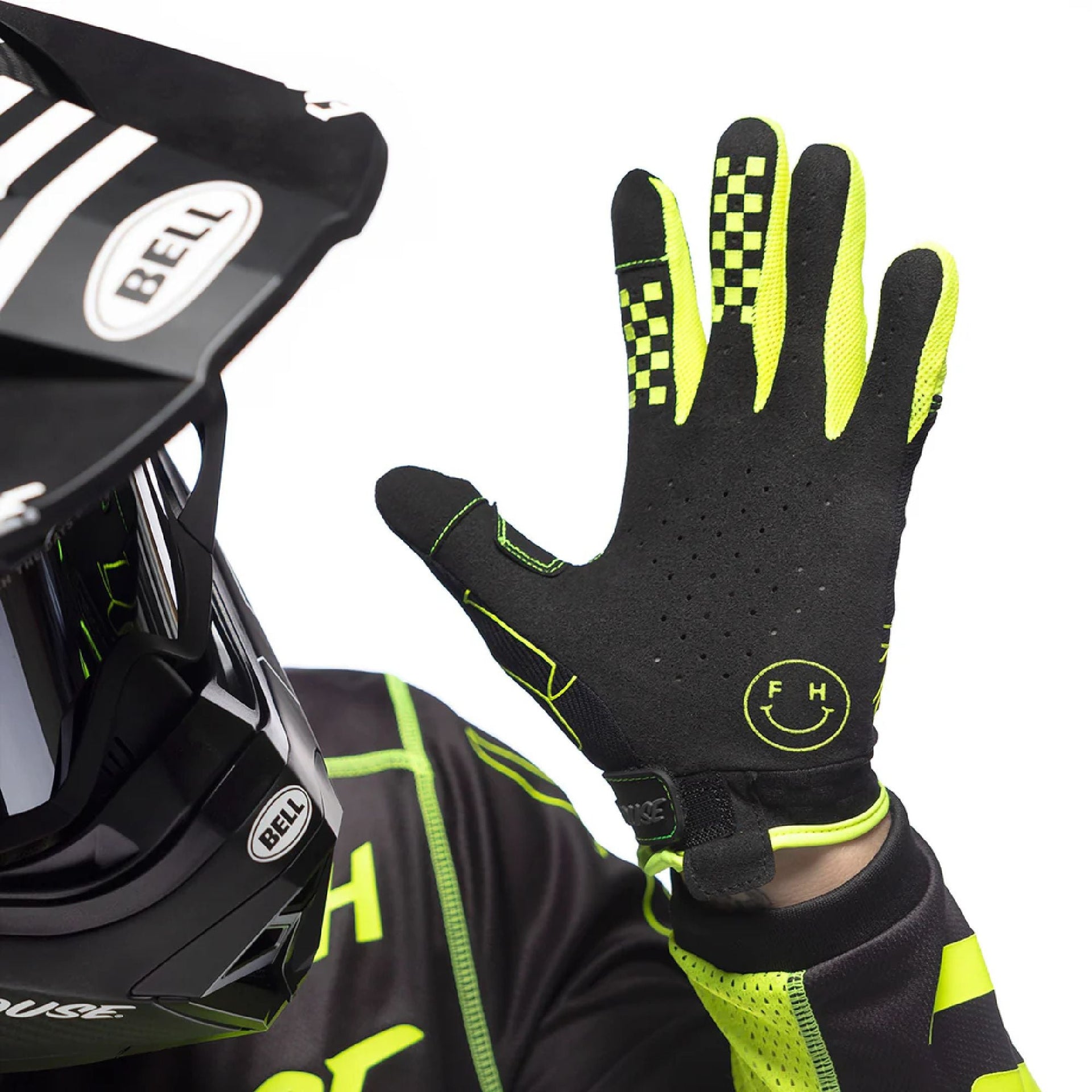 Black youth riding glove with neon green trim, perforated palm, and cuff logo