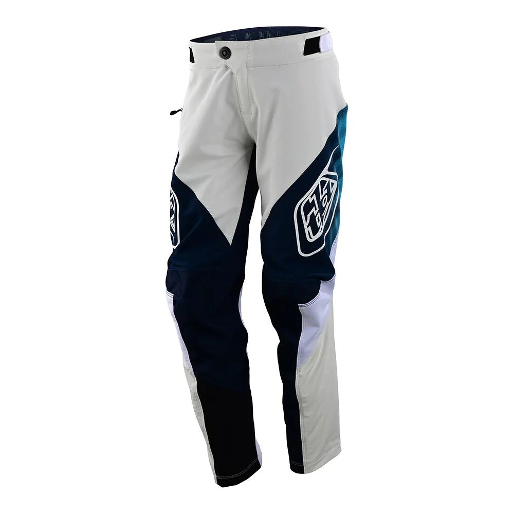 Youth sprint pants in white with dark navy panels and logo patch
