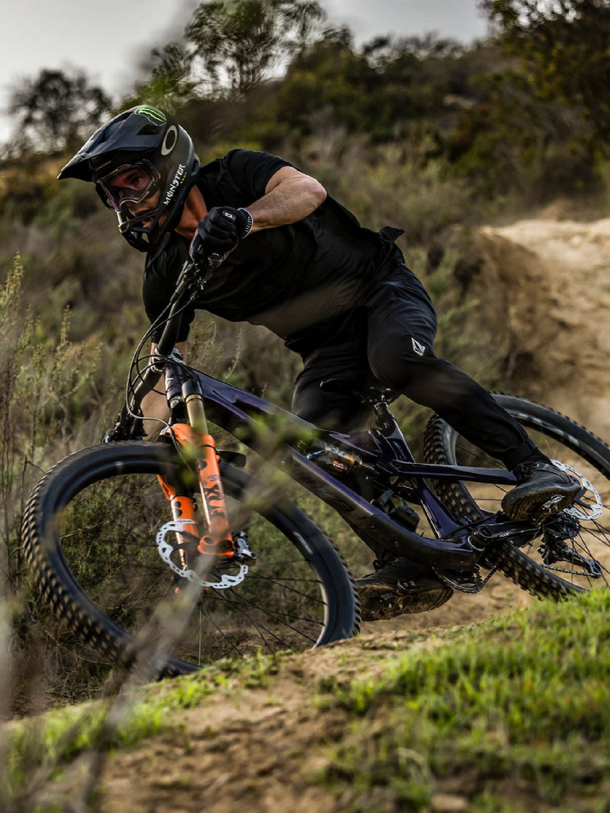 Black bike pants on a cyclist riding a mountain bike
