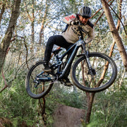 Cream long-sleeve cycling jersey worn by a rider on a mountain bike