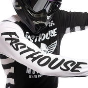 Youth motocross jersey close-up, black and white with large sleeve lettering