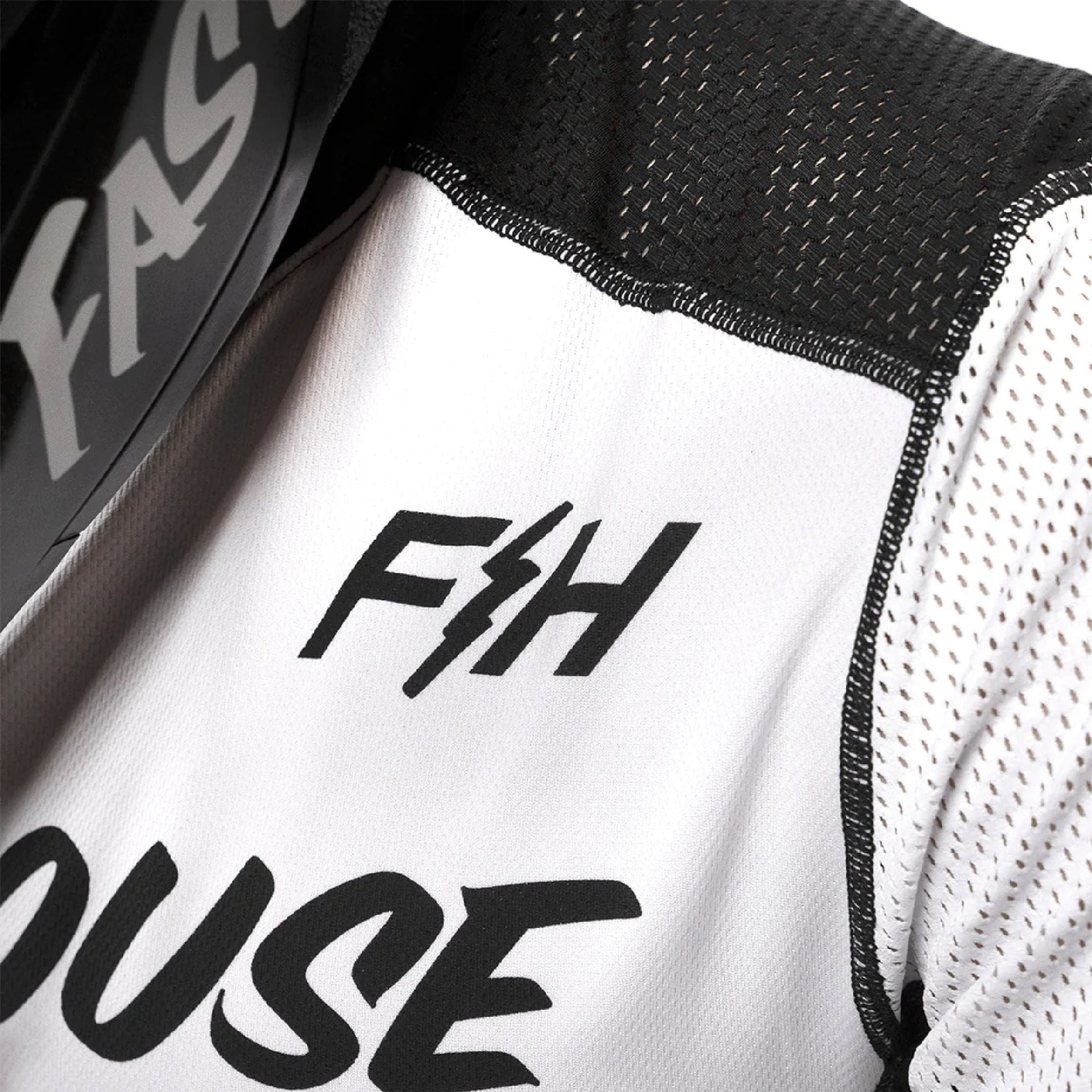 White and black youth air-cooled jersey with F&H logo on black-edged panel