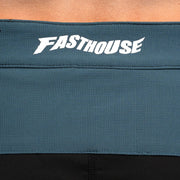 Fasthouse velocity shorts waistband with Fasthouse logo on teal-blue fabric