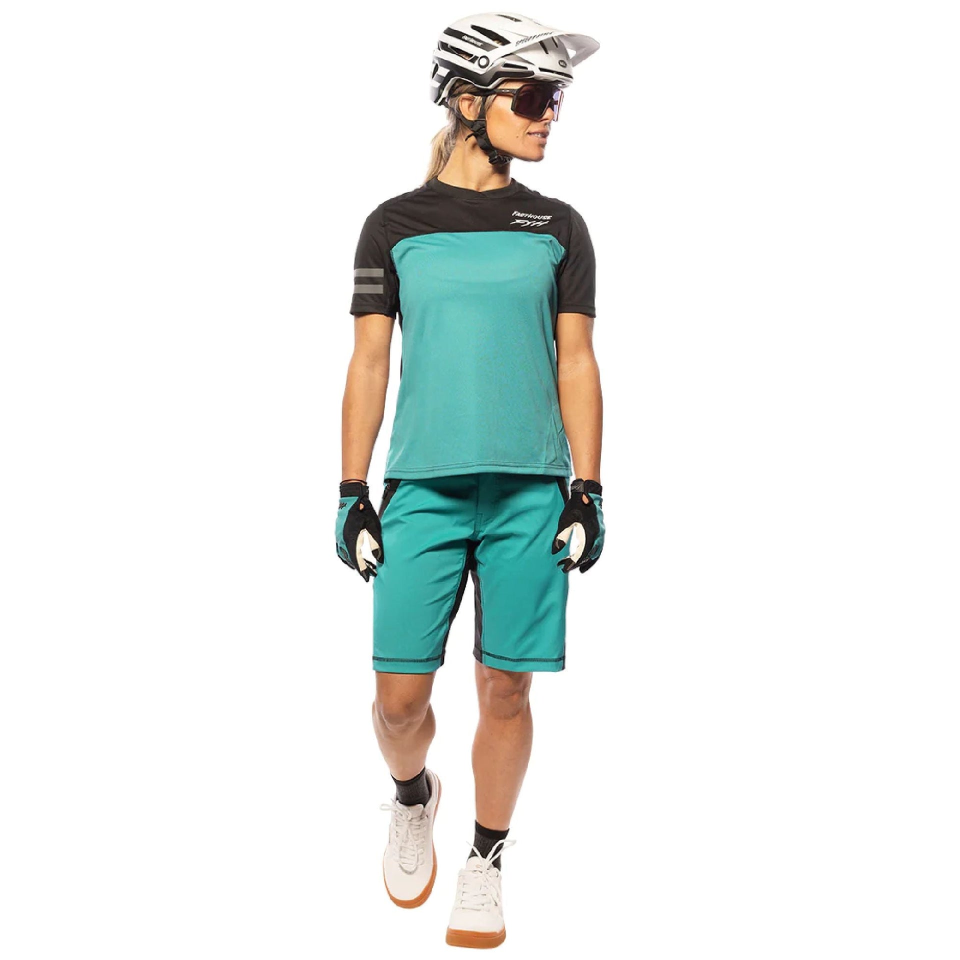 Women's cycling jersey back view, teal panel with black sleeves and arm stripe