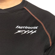 Fasthouse Sidewinder jersey logo on black raglan neck with orange contrast seam.