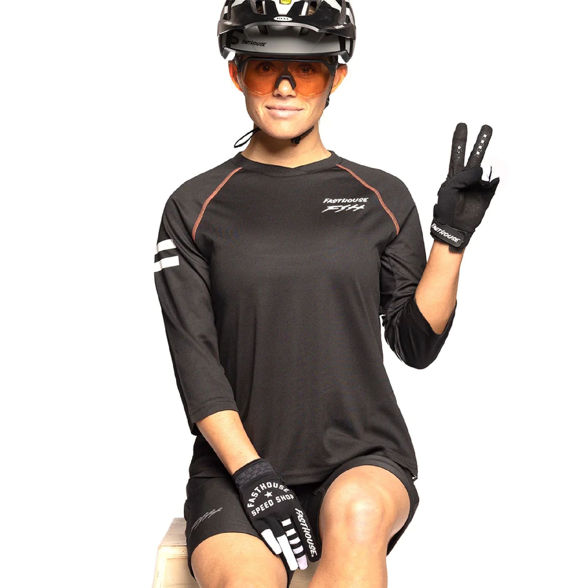 Women’s Fasthouse Sidewinder jersey worn: black raglan 3/4 sleeves with orange seams, logo.