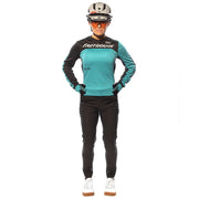 Women’s riding pants, black, full length with cuffed hem, worn by model