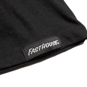 Women’s black T-shirt hem with stitched edge and Fasthouse logo patch