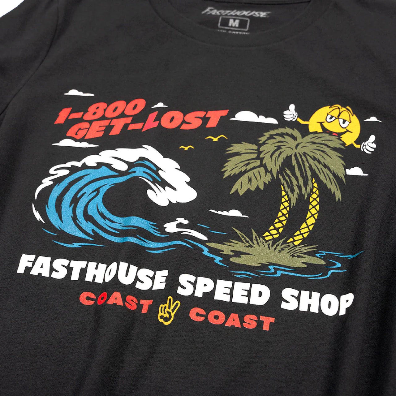 Women’s black T-shirt front close-up: blue wave, palm tree, yellow character graphic