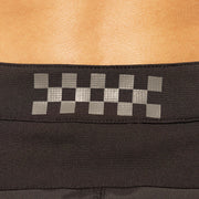 Fasthouse checkered logo waistband on black riding shorts