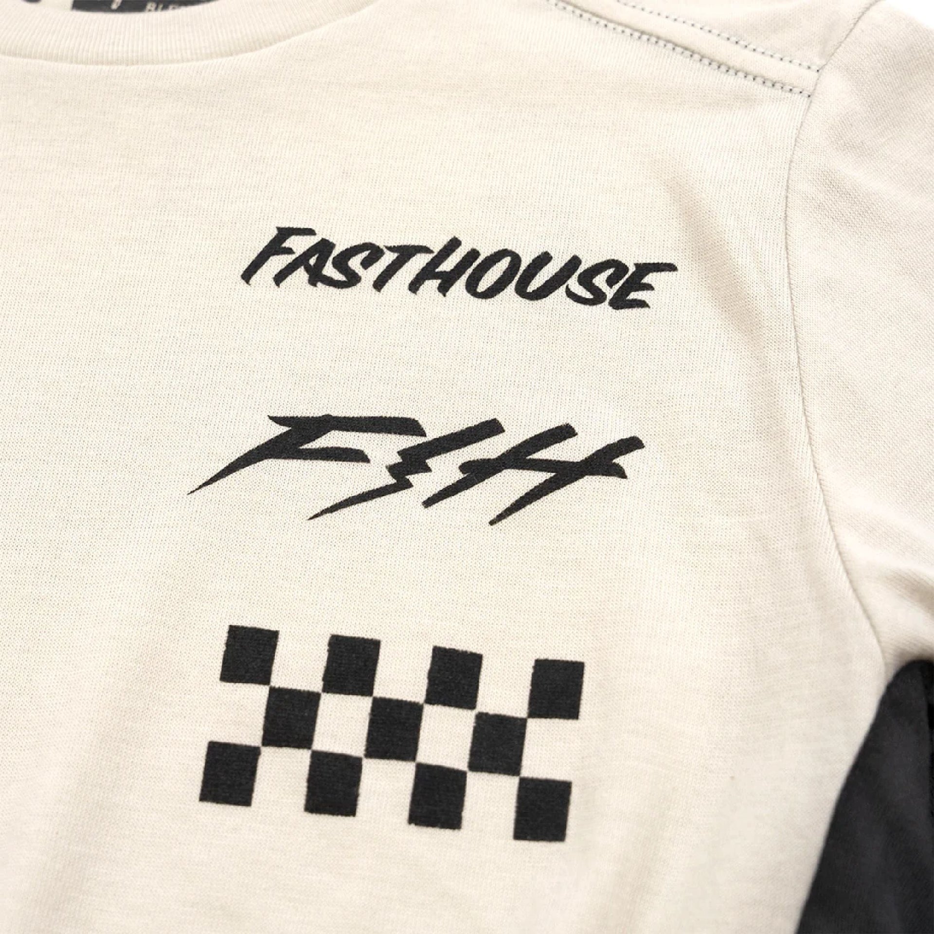Cream women’s tech tee back close-up with Fasthouse logo and checkered graphic