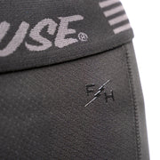 Black liner shorts with embroidered Fasthouse emblem on leg panel