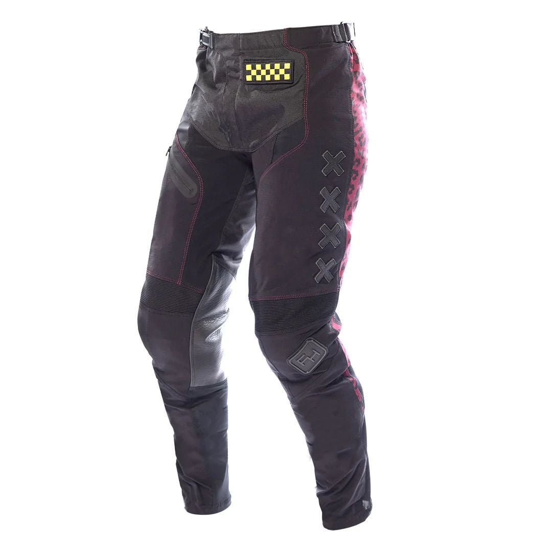 Girls' black riding pants with checkered patch, pink accents, knee guards and zip cuffs