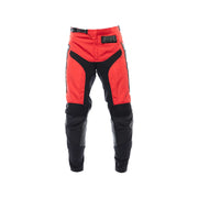 Youth motocross pants in bright red with black lower legs and knee armor, Fasthouse.