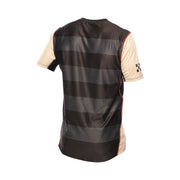 Youth short-sleeve jersey, cream and dark with gray stripe panels on the back