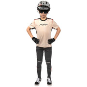 Youth short-sleeve jersey, cream front with white logo and black collar trim