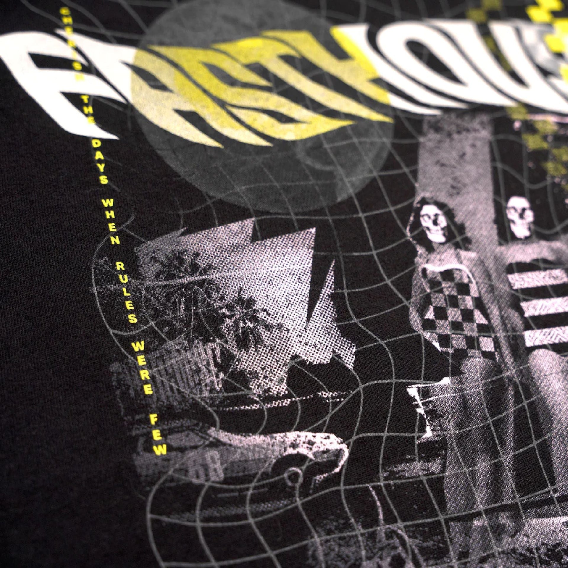 Black youth short-sleeve tee close-up: glitch graphic with checkered figures