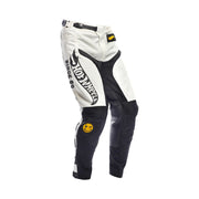 Kids motocross pants, white with black side graphics and Hot Wheels patch at hip