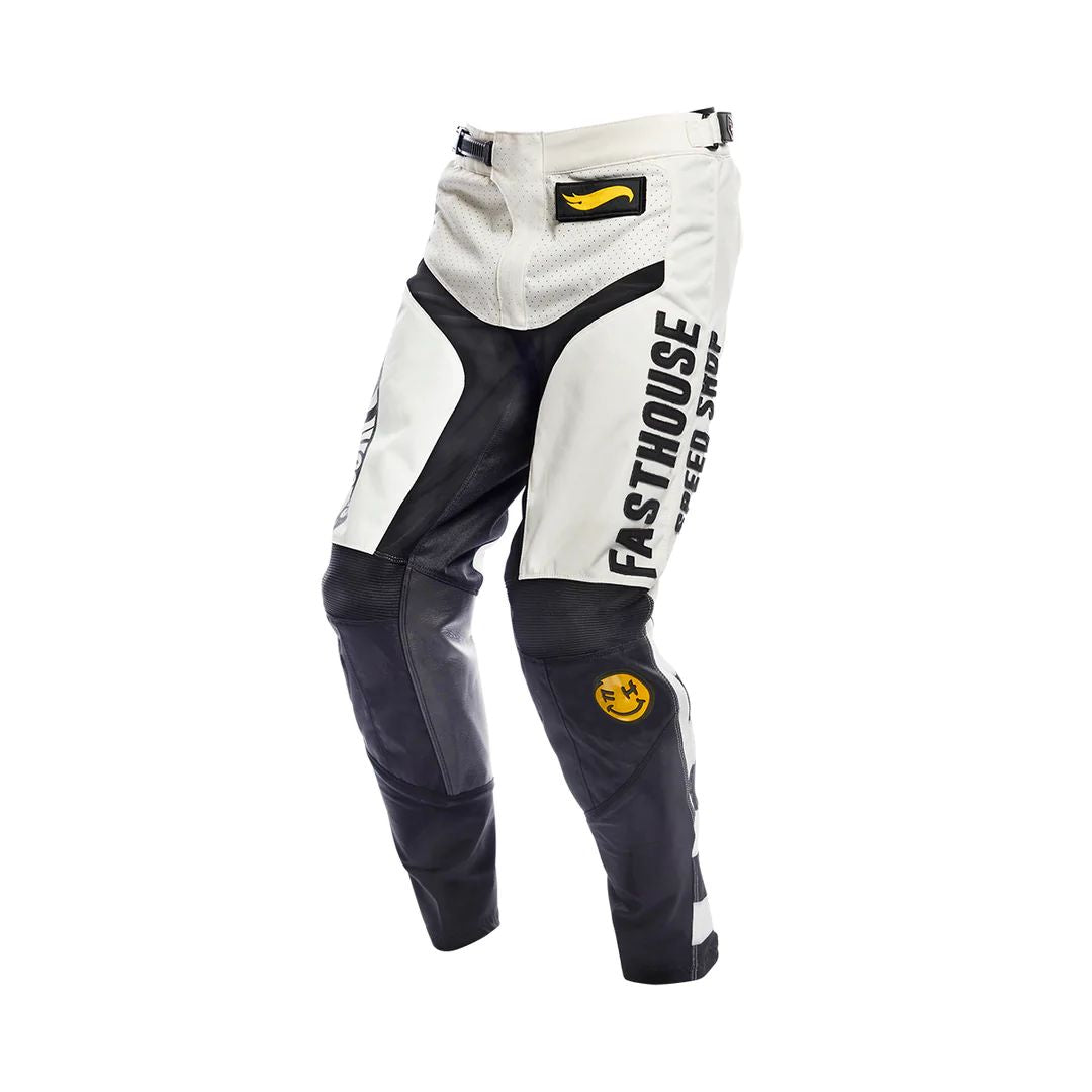 Kids motocross pants, white with black panels, Fasthouse logo and knee protection