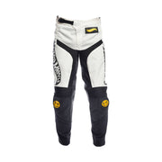 Kids motocross pants, white and black with Fasthouse logo and curved side graphics