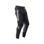 Youth motocross pants in black with white side panels and knee armor, Fasthouse logos.