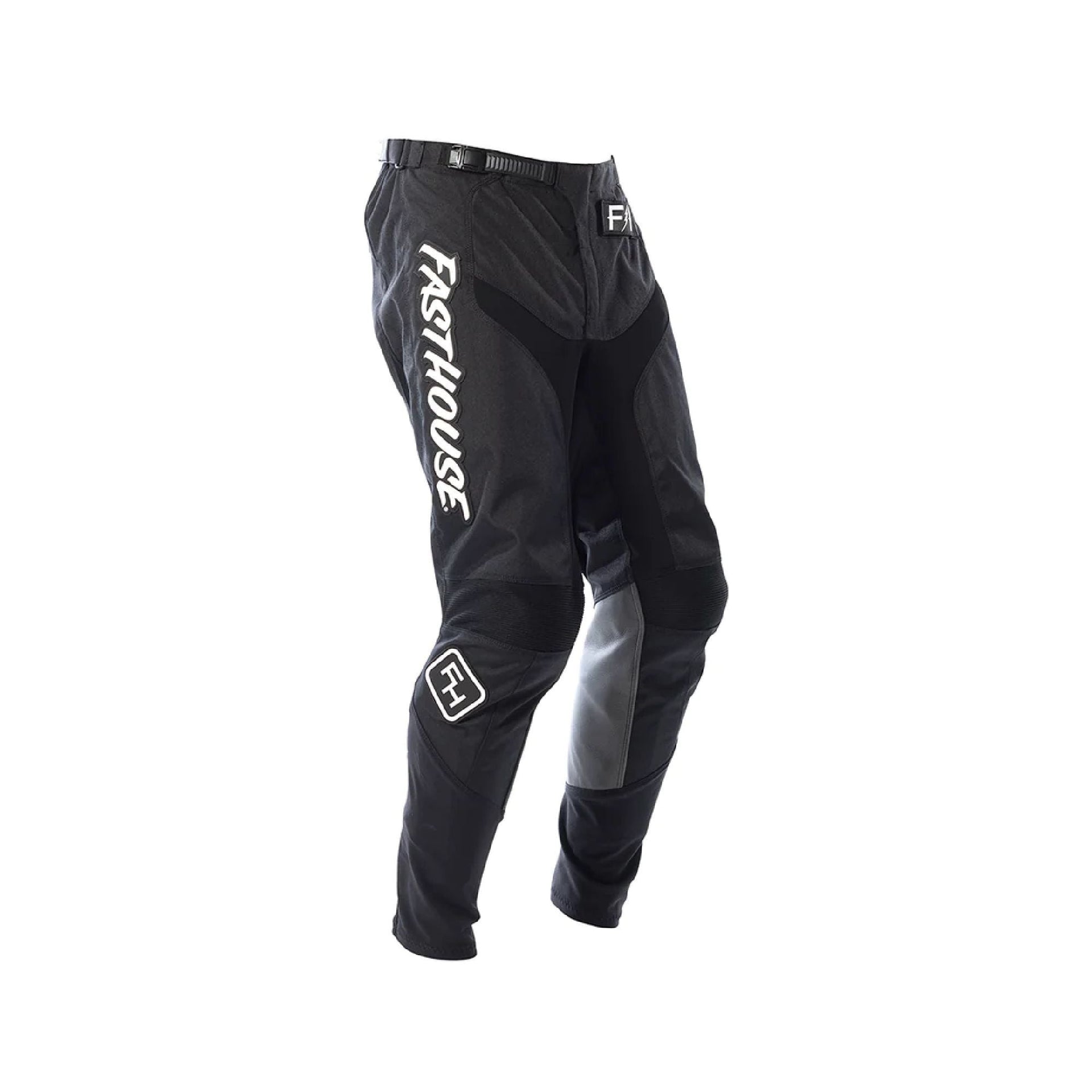 Youth motocross pants in black with white side panels and knee armor, Fasthouse logos.