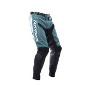 Youth motocross pants in teal and black with knee armor and side graphics, Fasthouse.