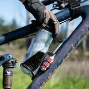 Blackburn carbon side-entry bottle cage on bike frame holding a bottle