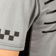 Men's light heather grey jersey sleeve with black piping and geometric graphic detail.