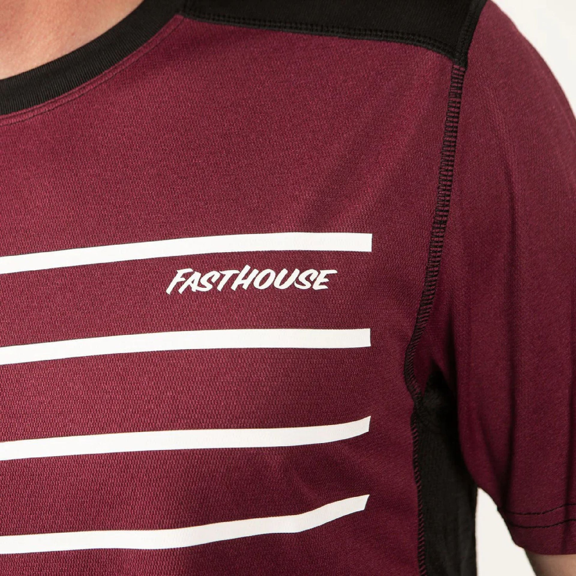 Men's maroon short-sleeve jersey with white horizontal stripe graphics and FastHouse logo.
