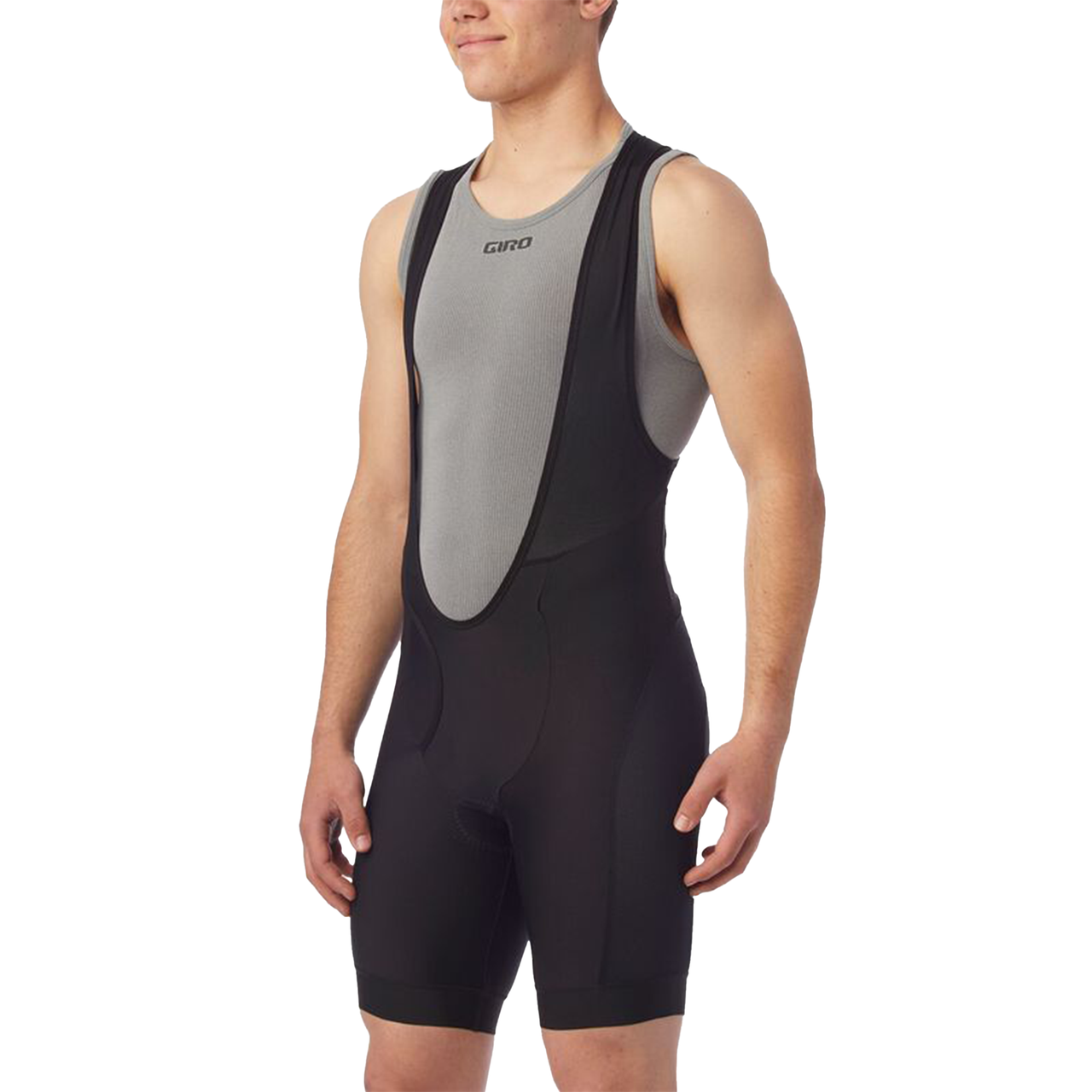 Black cycling bib shorts with gray front panel and chamois padding, side view