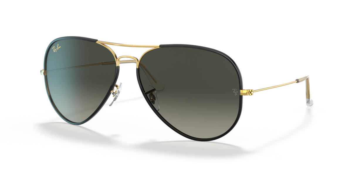Ray-Ban RB3025JM aviator sunglasses, gold frame, dark gradient lenses, clear tips